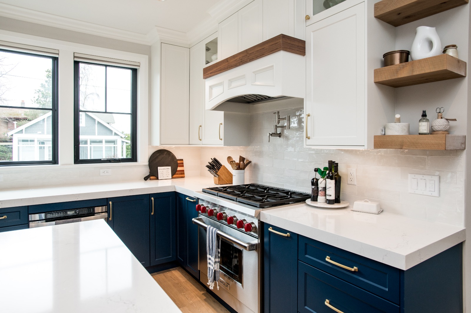 Custom range hood with hand-glazed tile backsplash